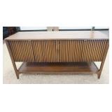 1047	BROYHILL BRASILLIA SIDEBOARD WITH 1 DOOR WHICH HAS A SLIGHT CUP. 60 IN X 19 1/2 IN X 30 1/2 IN 