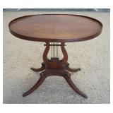 1084	LYRE BASE OVAL STAND W/ BRASS FEET, 26 1/4 IN X 19 1/2IN, 26 1/4 IN H 