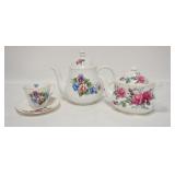 1187	LOT OF TWO BONE CHINA CHINA TEAPOTS & A CUP & SAUCER TALLEST POT IS 7 1/2 IN 