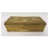 1257	ORNATE CIGARETTE BOX MADE BY JENNINGS BROTHERS 11 1/4 IN X 5 IN X 4 IN, HAS WEAR TO GILT FINISH