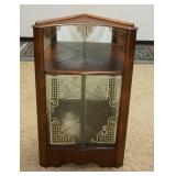 1002	SMALL BIEDERMEIER STYLE MIRROR BACKED CORNER CURIO CABINET W/ SILVER ACCENTED SLIDING GLASS DOO