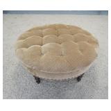 1025	LARGE ROUND TUFTED UPHOLSTERED OTTOMAN