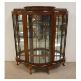 1080	MIRROR BACK CHINA CABINET, GLASS SHELVES, BOWED DOOR, CURVED SIDE, HAS A LIFT TOP COMPARTMENT O