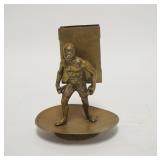 1099	FIGURAL BRASS MATCHBOOK HOLDER SAYS *RUB LIGHTLY* ON THE FRONT. 5 1/4 IN H 