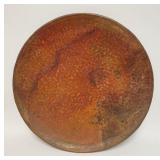 1107	HEAVY HAMMERED COPPER HANGING PLAQUE HAS ROLLED EDGE, 23 3/4 IN DIAMENTER. 