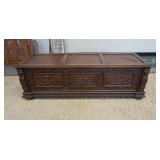 1135	HEAVILY CARVED BELGIAN BLANKET CHEST WITH LION HEADS, PEOPLE, ETC. 63 IN WIDE X 20 IN HIGH X 20