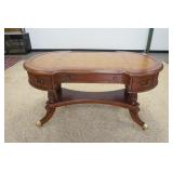 1138	HOOKER SEVEN SEAS LEATHER TOP DESK, WITH BRASS FEET AND CASTORS. 60 IN X 32 IN X 30 1/2 IN HIGH