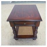 1142	LANE 1 DRAWER END TABLE WITH CANED SHELF BENEATH. 28 IN X 23 IN X 26 1/2 IN HIGH