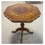 1165	LAMP TABLE WITH INLAID TOP, TURNED PEDESTAL, AND CARVED FEET. FINISH WEAR ON TOP, 28 IN X 29 1/