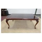 1172	THOMASVILLE DINING ROOM TABLE WITH BANDED TOP ON CABRIOLE BALL AND CLAW LEGS. 2 LEAVES. 76 IN X