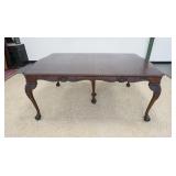 1177	CHIPENDALE STYLE DINING TABLE WITH 5 LEAVES. SKIRTED FINISH WORN, SOME VENEER LOSS. 48 IN X 72 