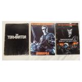 1009	LOT OF THREE THE TERMINATOR MOVIE PRESS KITS. LOT INCLUDES THE TERMINATOR; CONTAINS 7 PRINTS IN