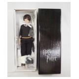 1057	12 IN HARRY POTTER TONNER DOLL, COMES W/ STAND & ACCESSORIES. NEW IN BOX!