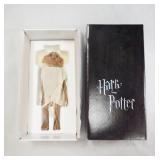 1073	HARRY POTTER TONNER 10 IN DOBBY DOLL W/ BASE IN ORIGINAL BOX. 