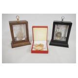 1074	LOT OF THREE HARRY POTTER NECKLACES, TWO COME IN NICE DISPLAY CASES. DISPLAY CASES ARE 4 3/4 IN