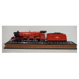 1104	HARRY POTTER HOGWARTS RAILWAYS DIE CAST STEAM LOCOMOTIVE & TENDER ON TRAIN TRACKS BASE. BASE IS