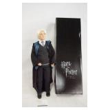 1119	HARRY POTTER TONNER DOLL DRACO MALFOY AT HOGWARTS, COMES W/ STAND, BASE, WAND & ORIGINAL BOX. 1