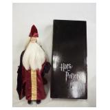 1121	HARRY POTTER TONNER DOLL PROFESSOR DUMBLEDORE, COMES W/ STAND, BASE, GLASSES, HAT & ORIGINAL BO