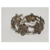 1050	STERLING SILVER BRACELET W/FLORAL ROSETTES, 0.845 TOZ
