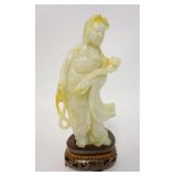 1070	CARVED STONE ASIAN FIGURE, HAS A WOODEN FITTED BASE, 8 1/2 IN TOTAL HEIGHT