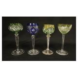 1095	4 COLOR CUT TO CLEAR GOBLETS, ALL HAVE CUT STEMS & FEET, ONE HAS GOLD ENAMELING & AN AIR TWIST 