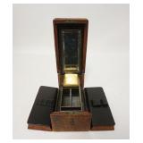 1106	TRAVELING VANITY CASE, LOT INCLUDES AN ANTIQUE WATCH FOB, CASE IS 8 1/4 IN X 4 1/2 IN X 4 3/4 I