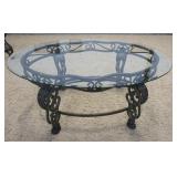 1158	GLASS TOP COFFEE TABLE ON FANCY PAW FOOT METAL BASE, GLASS HAS SOME SCRATCHING, 4 FOOT X 33 IN 