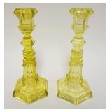 1181	PAIR OF TALL FLINT GLASS VASELINE GLASS CANDLESTICKS, 9 1/8 IN HIGH. BASE CHIPS AND CRACK AT TO