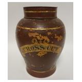 1191	STONEWARE TOBACCO JAR *CROSS CUT*. HAS ORIGINAL TINE LID, 11 3/4 IN HIGH