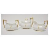 1205	T & V LIMOGES 3 PIECE TEA SET WITH GOLD DECORATION. TEA POT IS 4 1/4 IN HIGH