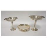 1223	3 WEIGHTED STERLING SILVER CANDLESTICKS, TALLER 2 HAVE DENTS, TALLEST IS 6 1/4 IN