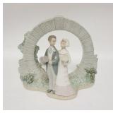 1244	LLADRO BRIDE & GROOM W/ARCHWAY, 9 3/4 IN HIGH