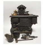 1266	ACME CAST IRON TOY STOVE W/ ACCSESSORIES 11 IN W, 12 1/2 IN H 