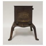1267	CAST IRON DRYING OVEN. A.C. CLARKE & CO.  CHICAGO, FOR DRYING DENTURES BASE IS 7 1/2 IN SQUARE,