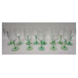 1285	13 ETCHED GOBLETS W/ GREEN FLUTED STEMS HAVE A MEDALLION OF A DANCING NUDE, 5 3/4 IN H ONE HAS 