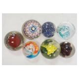 1218	7 HANDMADE GLASS PAPERWEIGHTS, LARGEST IS 2 3/4 IN DIAMETER
