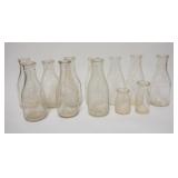 1279	12 OLD MILK BOTTLES, 2 ARE CREAM BOTTLES