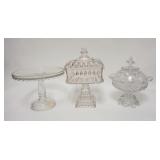 1290	3 PIECE ANTIQUE PATTERN GLASS, 2 LARGE COVERED COMPOTES & A CAKE STAND, TALLEST IS 12 1/2 IN
