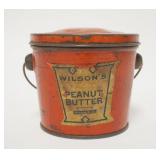 1296	WILSONS PEANUT BUTTER TIN, TOP HAS SOME DENTS, 4 IN HIGH X 4 IN TOP DIAMETER