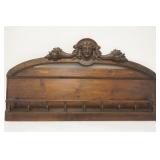 1303	FRUIT & FACE CARVED HANGING SHELF, HAS TURNED SPINDLES, 37 3/4 IN WIDE X 20 3/4 IN HIGH