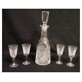1014	WATERFORD CRYSTAL 5 PIECE WHISKEY SET. THERE IS A SMALL BUMP ON THE SHANK OF THE STOPPER, DECAN