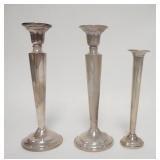 1027	3 PIECE WEIGHTED STERLING SILVER, CANDLESTICKS & BUD VASE, STICKS ARE 7 1/8 IN HIGH