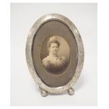 1031	STERLING SILVER PICTURE FRAME, HAS ENGRAVED DESIGN & OLD PHOTO, 7 IN X 5 IN