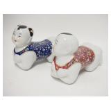 1084	PAIR OF ASIAN PORCELAIN FIGURAL PILLOWS, 8 3/4 IN LONG X 7 IN HIGH