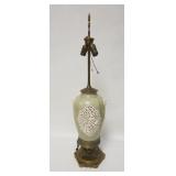 1152	POTTERY LAMP ON BRASS BASE, HAS OPEN WORK SIDES & FIGURAL HANDLES, 34 IN HIGH