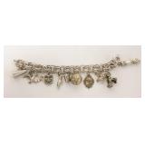 1168	STERLING SILVER CHARM BRACELET, FIST CHARM MARKED 800 WITH AN ANCHOR, MILK CAN AND MEDALLION MA