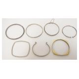 1181	7 BANGLE BRACELETS, NO MARKINGS FOUND