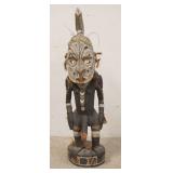 1202	PAINTED ETHNIC WOOD CARVING, MAN W/BIRD ON HIS BACK, 35 IN HIGH