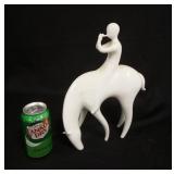 1287	ROYAL DUX MIDCENTURY MODERN FLUTE PLAYER ON HORSE, WHITE PORCELAIN, 9 IN X 12 1/2 IN HIGH