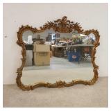 1311	LARGE MIRROR IN ORNATE GILT FRAME, 47 1/2 IN WIDE X 40 IN HIGH